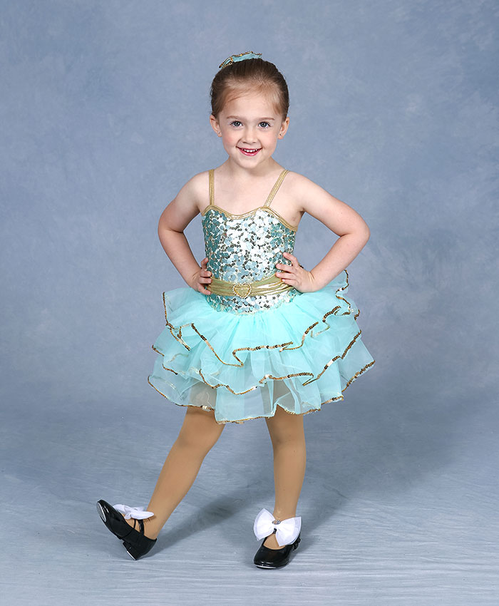 Dancer in a teal costume with tap shoes