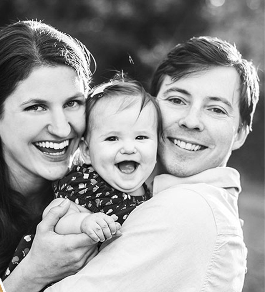Parents laughing with their baby