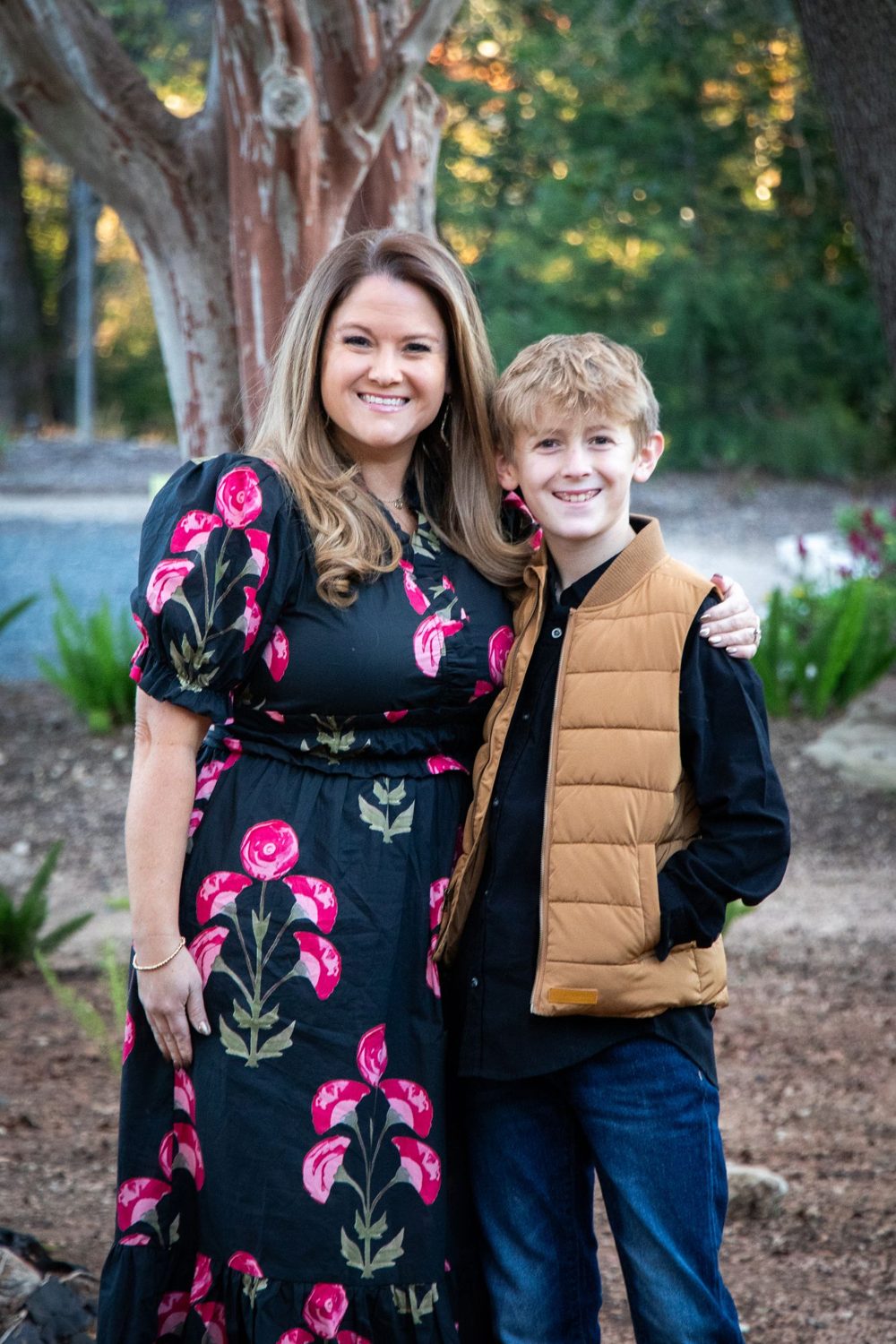 Mom and son smiling together outdoors